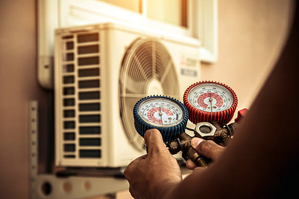 Professional Air Conditioning Service technician working in Dundee, MI
